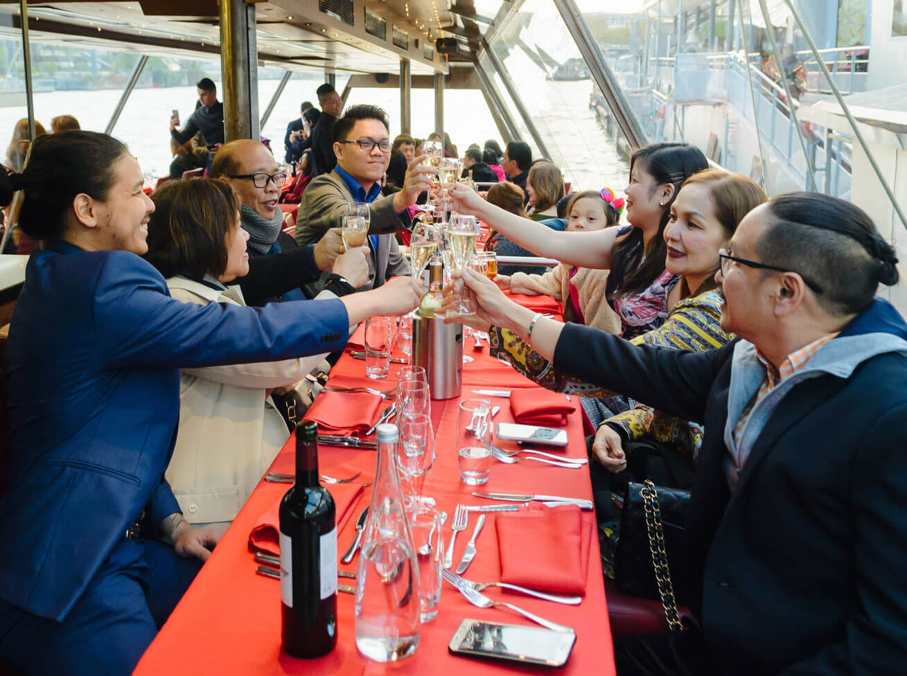 People celebrating with a glass of wine